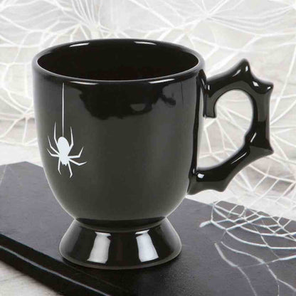 Black gothic-style teacup with spider accent on side and pedestal base