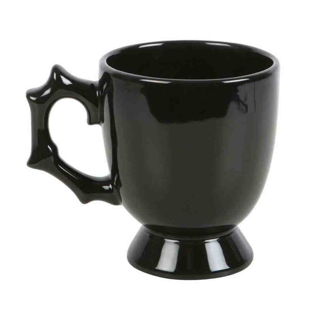 Black gothic-style spider teacup with spiked batwing handle and pedestal base
