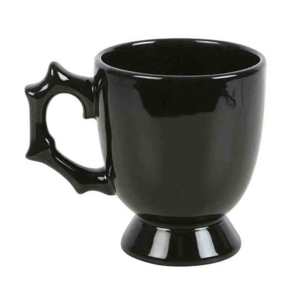 Black gothic-style spider teacup with spiked batwing handle and pedestal base