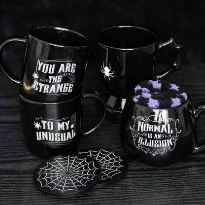 Set of black gothic teacups with spider web motifs and printed Halloween text