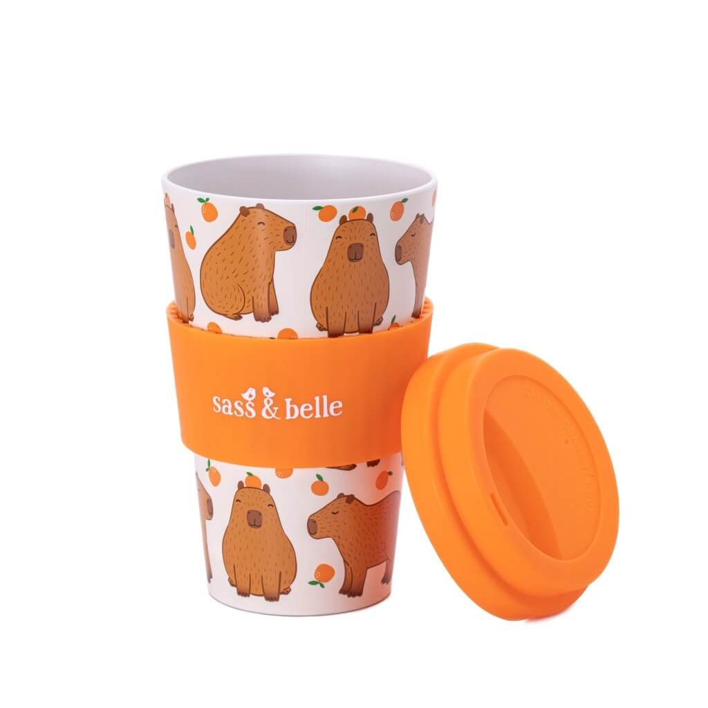 Capybara travel coffee mug with orange lid, cap off, capybara pattern on white body