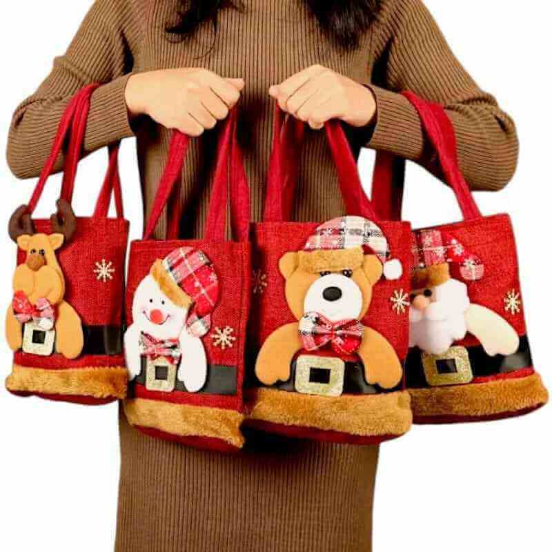 Red felt Christmas gift tote bag with gingerbread, snowman, and bear appliques