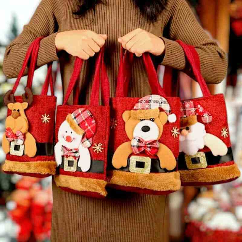 Red felt Christmas gift tote bag set with Santa, snowman, bear, and nutcracker figures