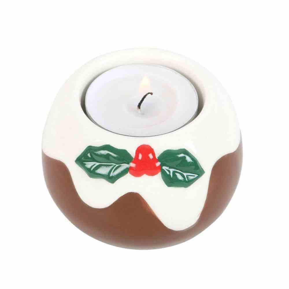 Pudding-shaped tealight candle holder with white top, brown base, green holly and red bell