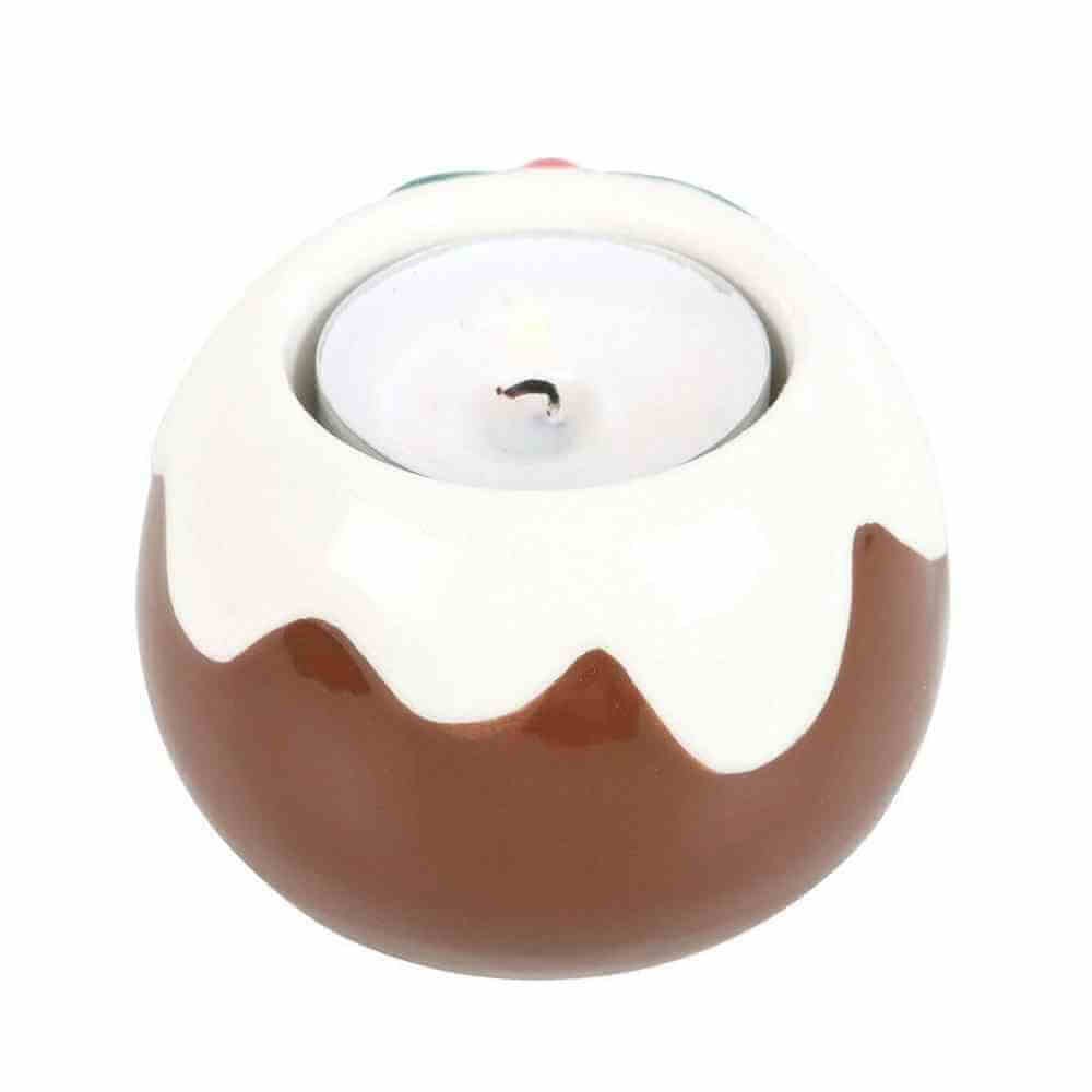 Pudding-shaped tealight candle holder with white drip top and brown base, lit tealight inside