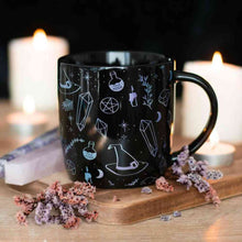 Black ceramic mug with witch hat and potion line art print, 360 ml capacity