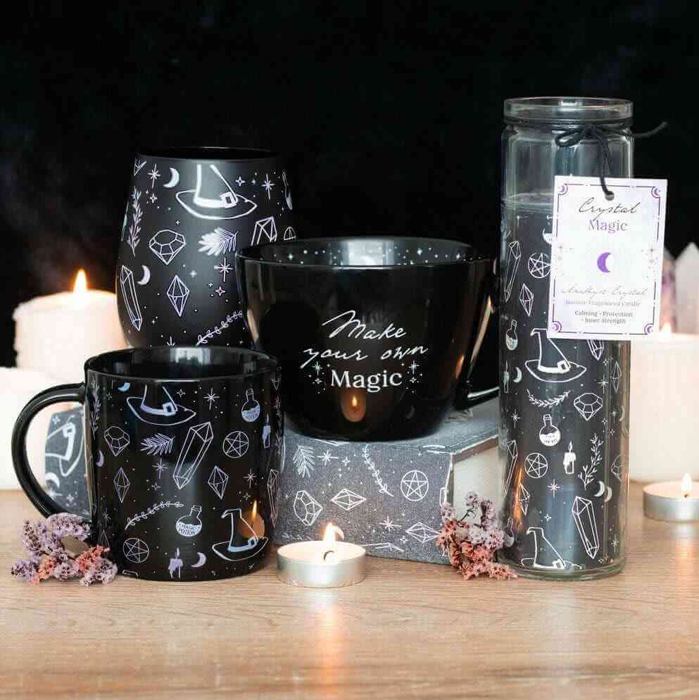Black witch print ceramic mug with matching boxed crystal magic potion item in view