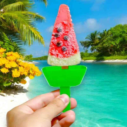 Green drip-proof ice lolly holder holding a red fruit ice pop with berries