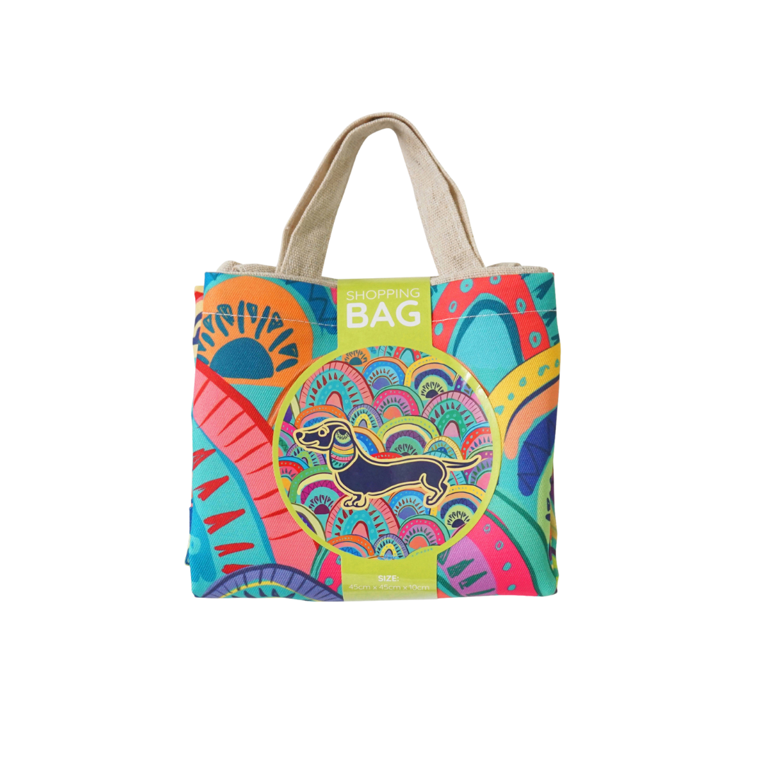 Reusable shopping bag with rainbow dachshund art, cream handles, front tag reading SHOPPING BAG