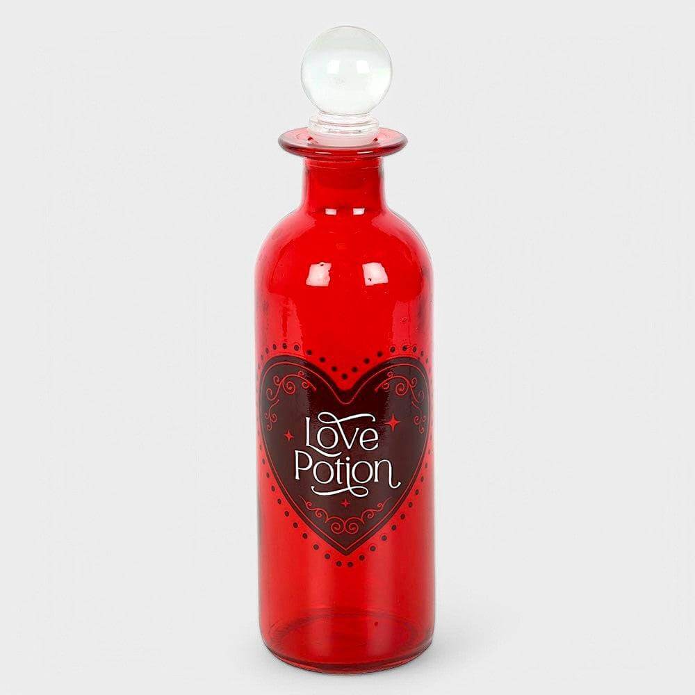Red glass love potion bottle with clear crown stopper and heart label