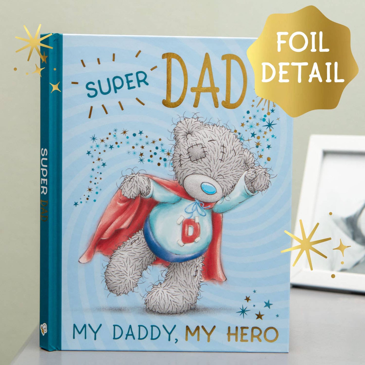 Super Dad gift book front cover with teddy hero, “DAD” title, and foil detail badge