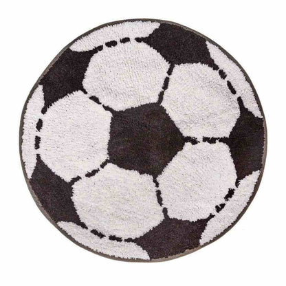 Round football-shaped rug with repeating black-and-white soccer ball motif and dashed stitching.