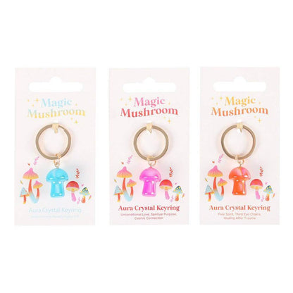 Three aura crystal mushroom keyrings on cards, blue, pink, orange