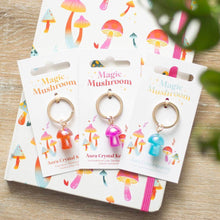 Aura crystal mushroom keyrings on cards, blue, pink, and orange