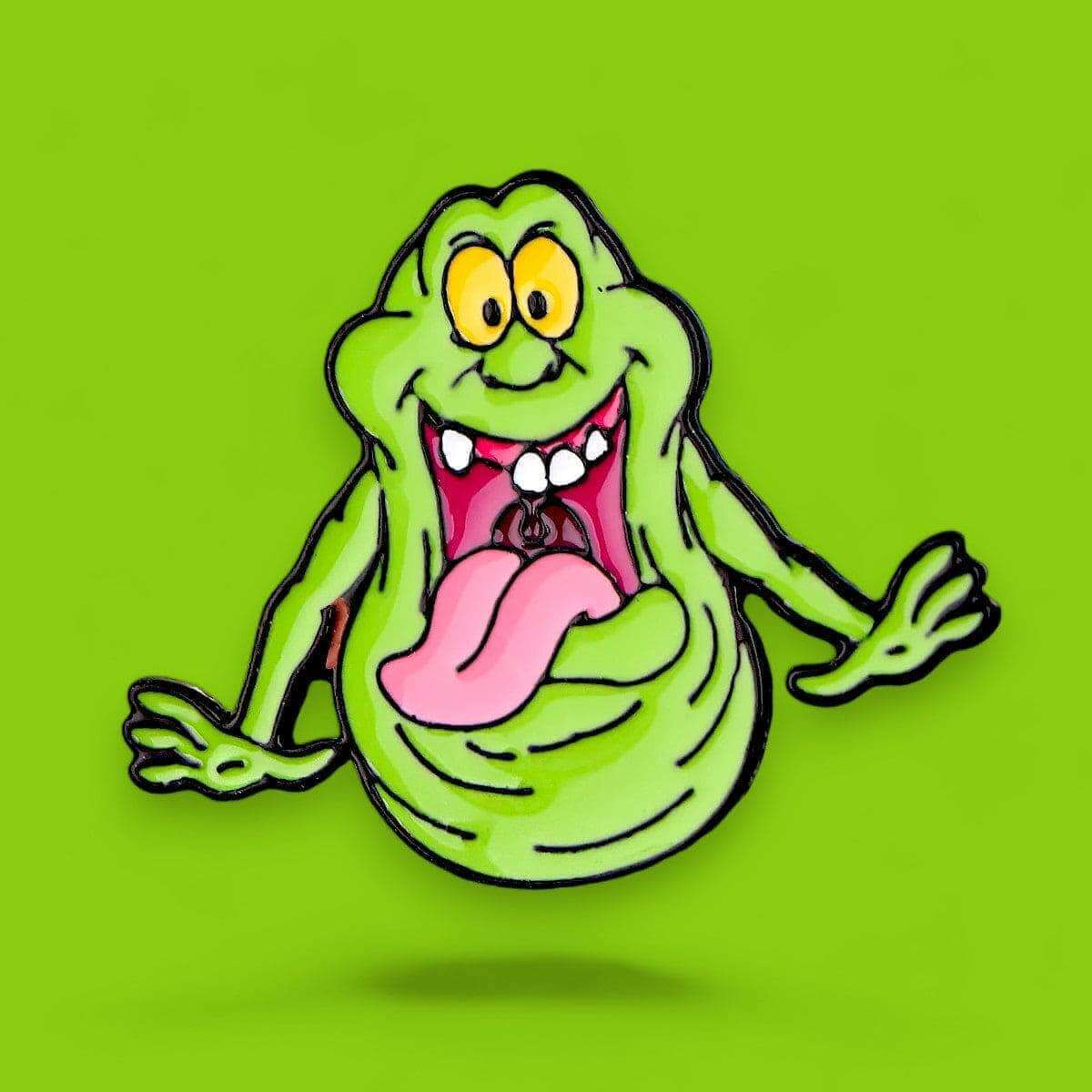 Slimer enamel pin featuring green ghost character with pink tongue and smiling mouth