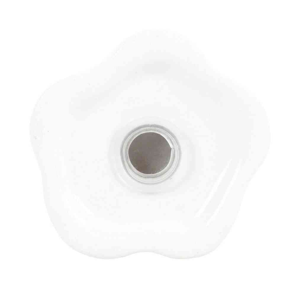 White ghost salt and pepper shaker bottom with round seasoning opening