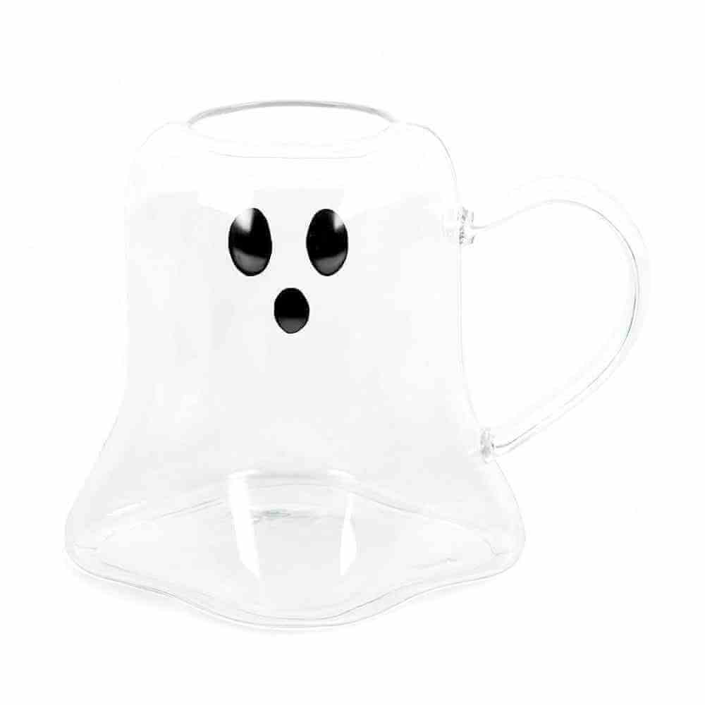 Ghost-shaped clear glass mug with black facial dots and curved handle