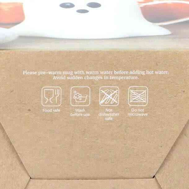 Glass ghost mug care label with icons and washing instructions