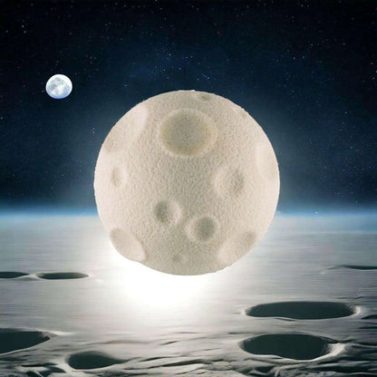 Moon-shaped rubber eraser with cream color and embossed crater-like spots