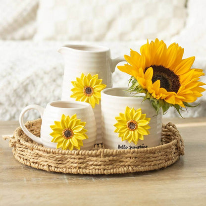 Set of small ceramic plant pots with sunflower accents in a woven tray