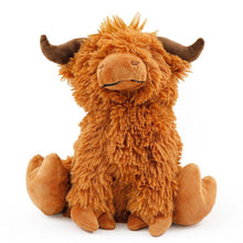 Plush Highland cow doorstop, shaggy orange-brown fur with curled horns