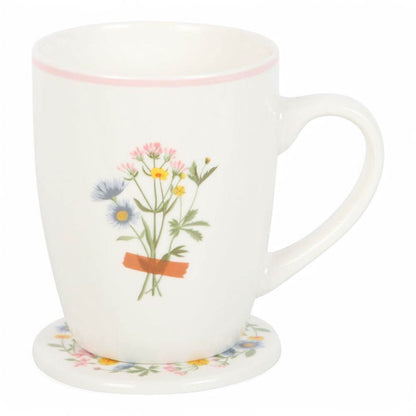 White ceramic mug with wildflower bouquet and round floral coaster