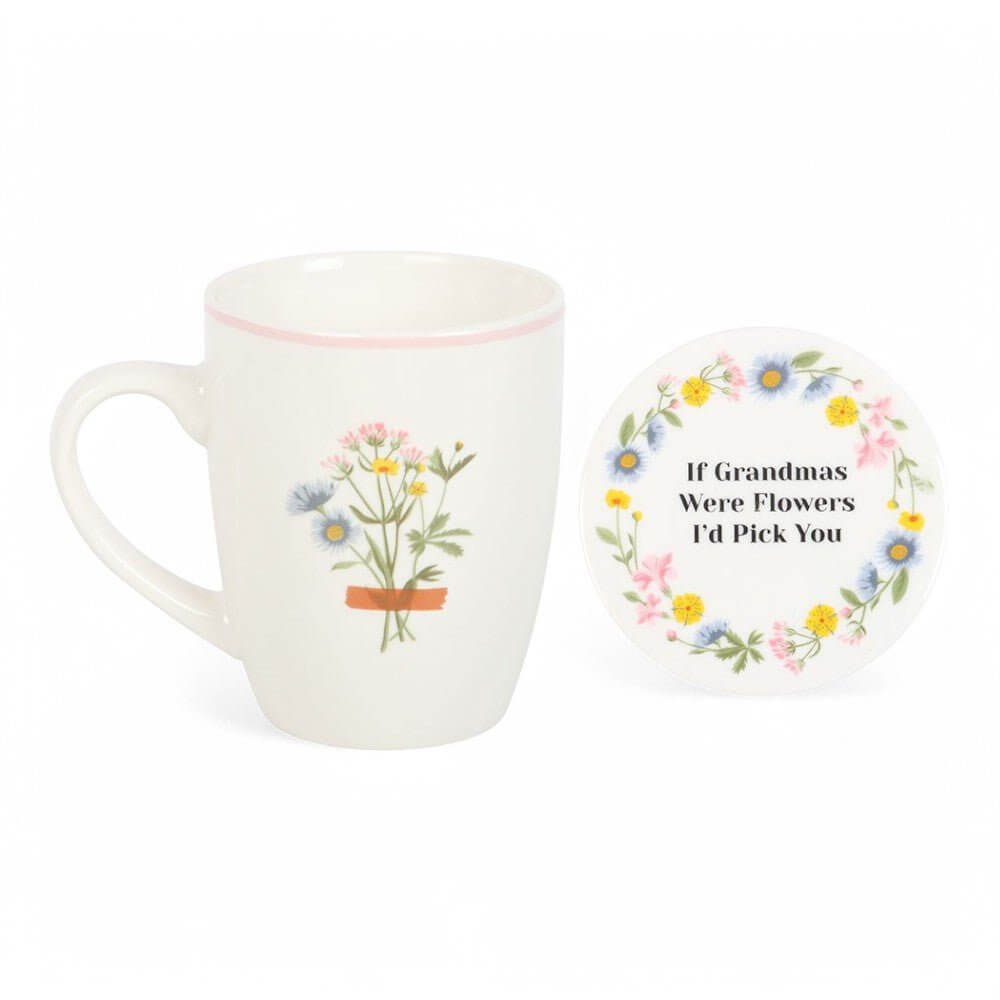 White ceramic mug and round coaster with wildflower wreath and quote text