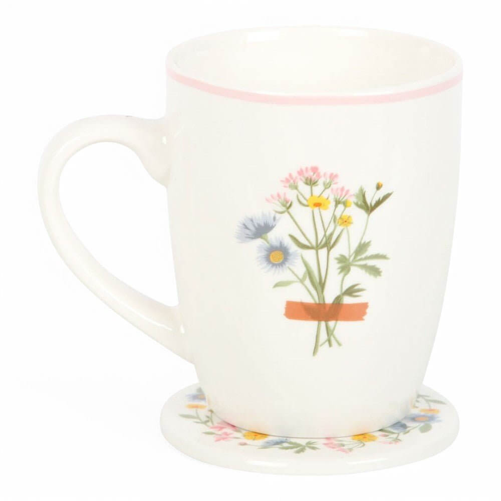 White ceramic mug with wildflower bouquet design and floral coaster underneath