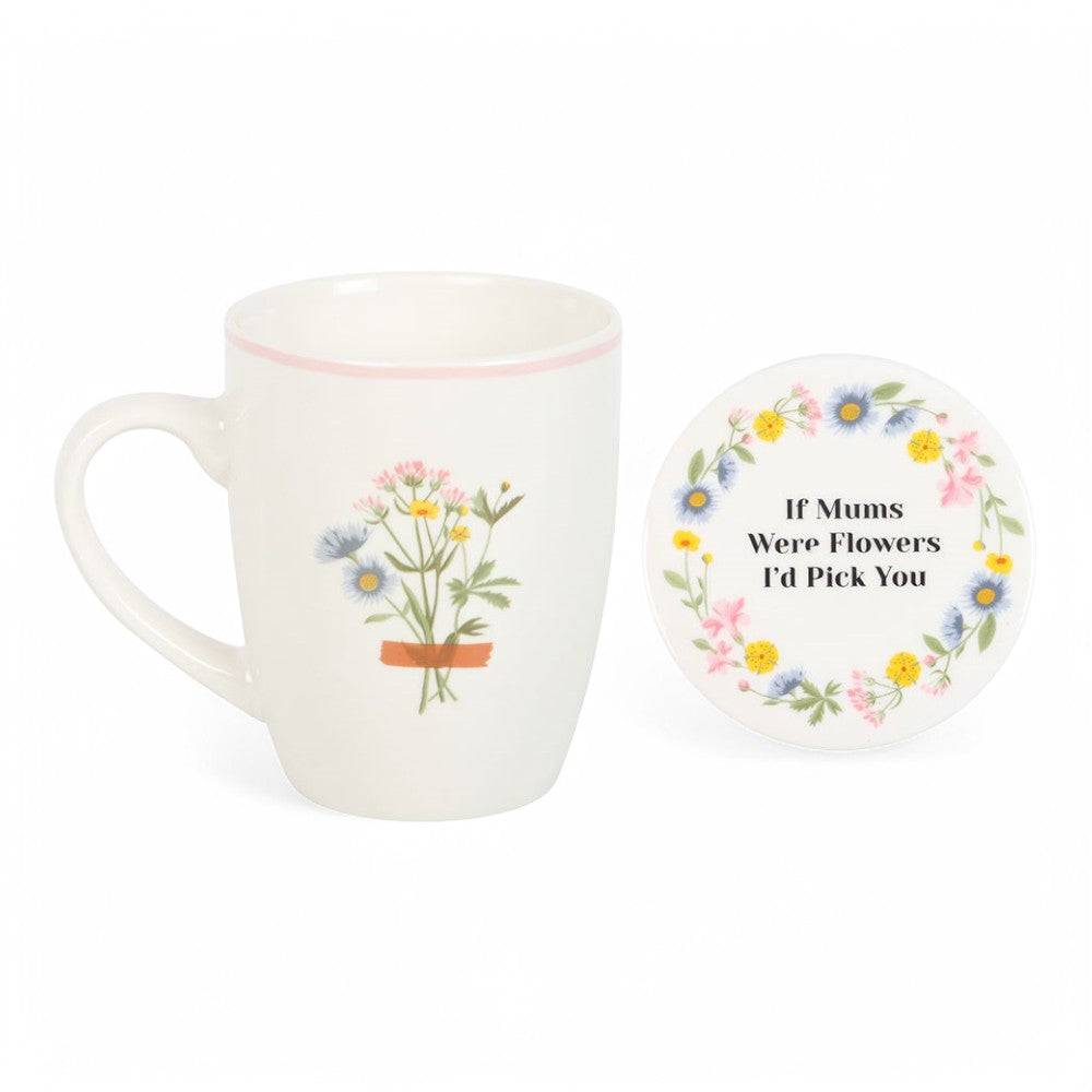 White ceramic mug with flower-pot bouquet print and pink rim; matching floral coaster with quote
