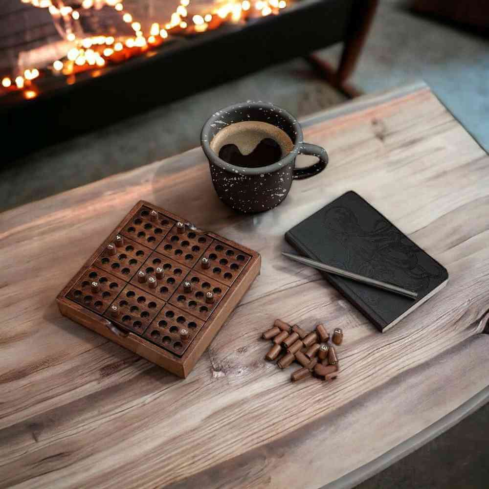 Wooden Sudoku puzzle board with marker pieces and black solution booklet