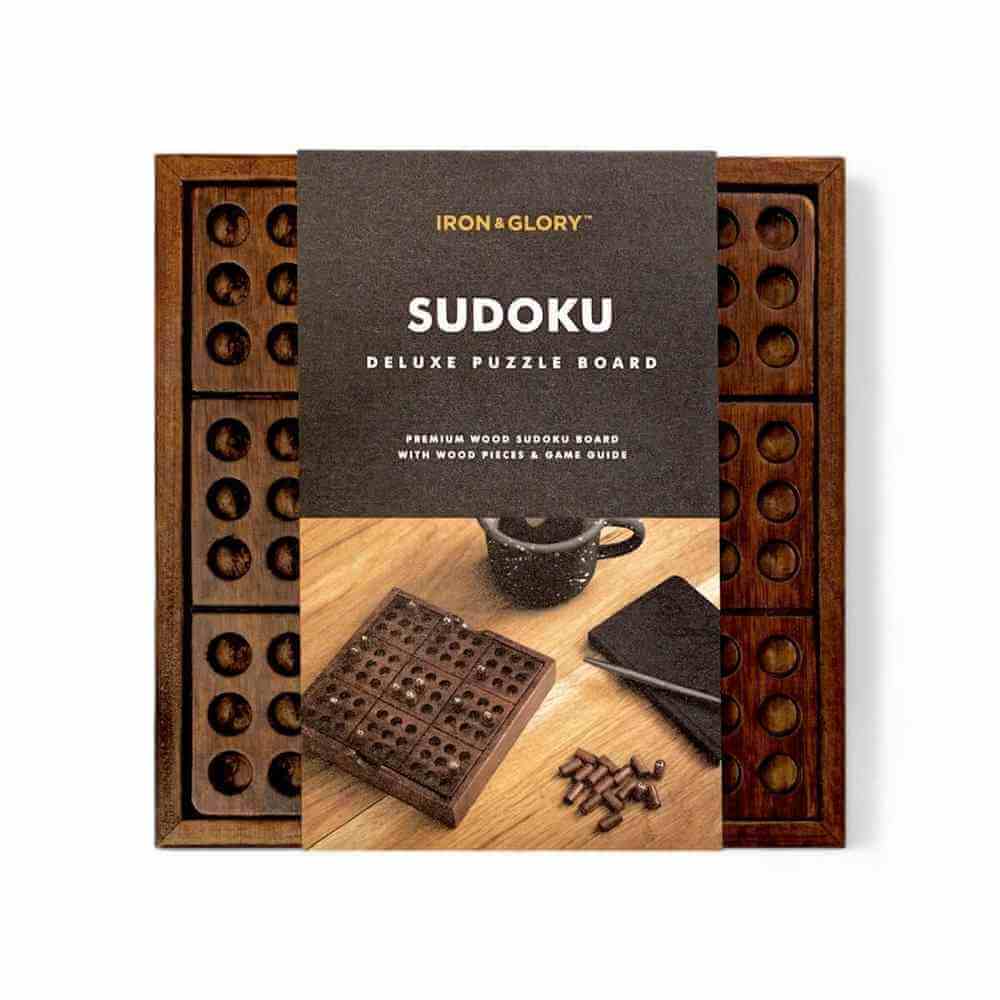 Wooden Sudoku puzzle set in open wooden box with instruction cover and pegs