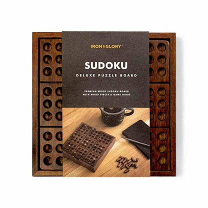 Wooden Sudoku puzzle set in open wooden box with instruction cover and pegs