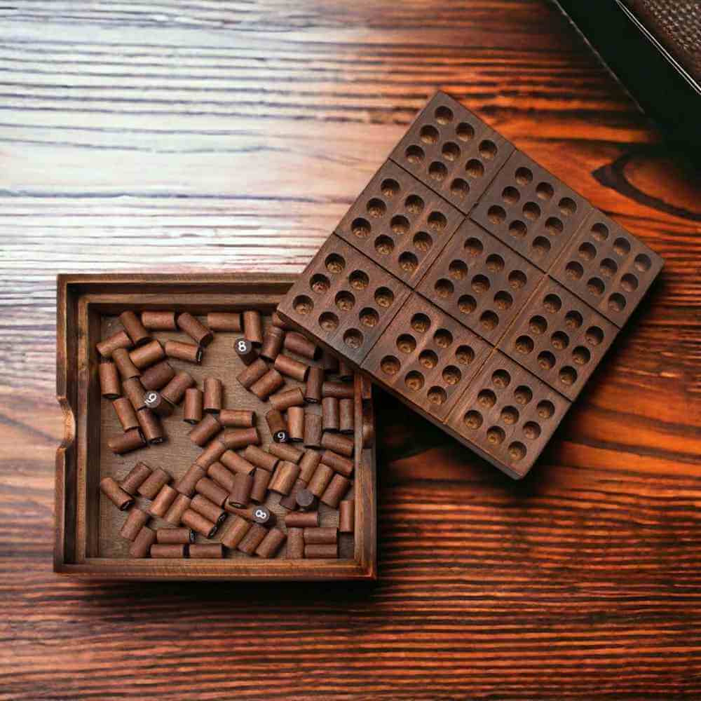 Wooden Sudoku board with grid insert and wooden peg markers on tray