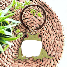 Frog keyring with round ring and green-and-cream cartoon frog charm
