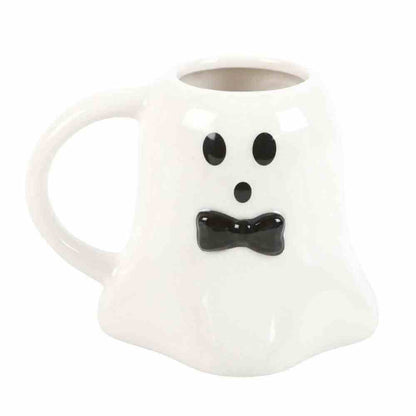 Ghost-shaped ceramic mug, white with black dot eyes and bow-tie smile