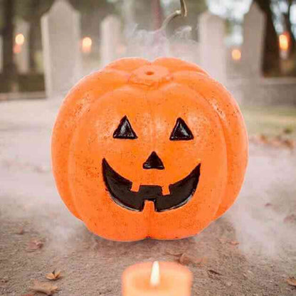 Orange jack-o'-lantern incense stick holder with smiling cutout face