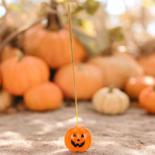 Small pumpkin incense stick holder with jack-o'-lantern face