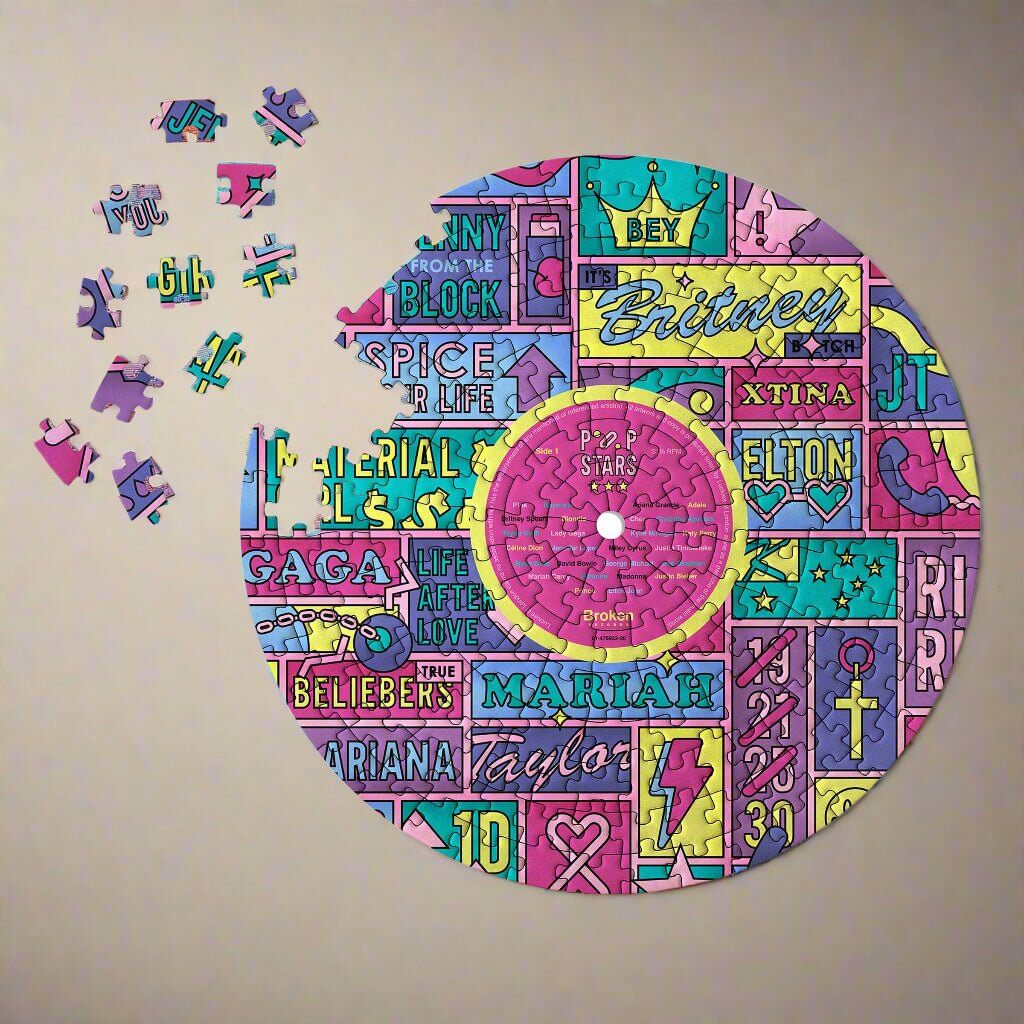 LP-shaped jigsaw puzzle showing colorful pop-star artwork with a few loose pieces