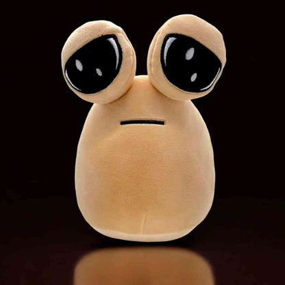 Beige plush alien soft toy standing, with large black eyes and flat mouth