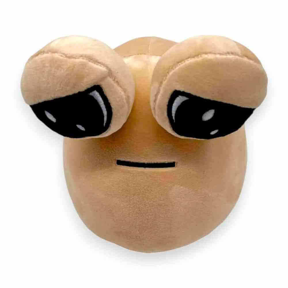Beige plush alien soft toy close-up face with two large black eyes