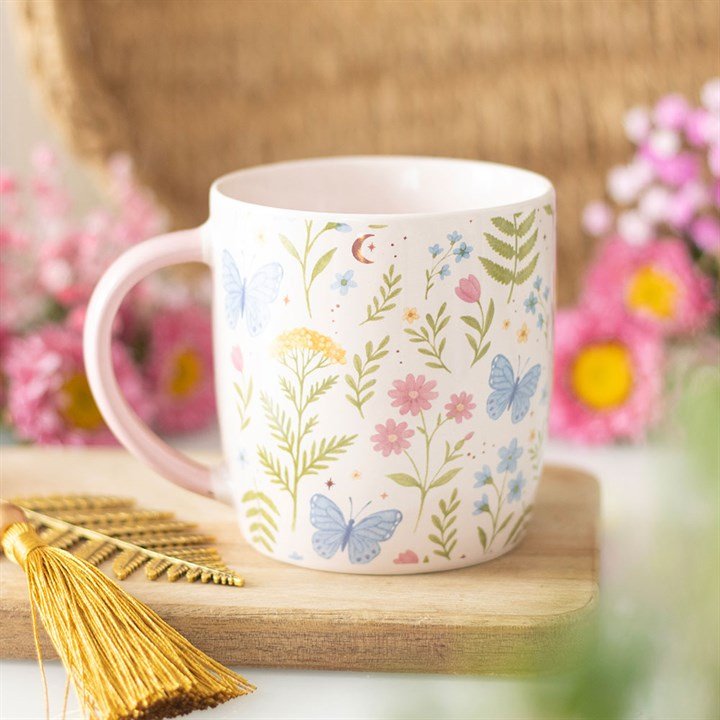 Floral print ceramic mug, white with leaves and butterflies, pink handle