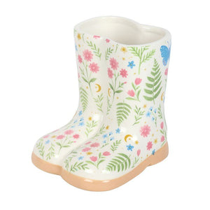 Ceramic floral welly boot planter with botanical print, small indoor plant pot on a white background.