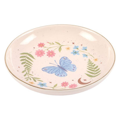 Round butterfly trinket dish in light pink ceramic with floral garden illustration