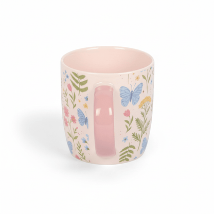 Floral ceramic mug with pink interior, multicolor leaves and butterflies, pink handle
