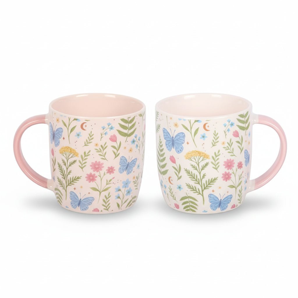 Pair of floral print ceramic mugs, white with colorful leaves and butterflies, pink handles