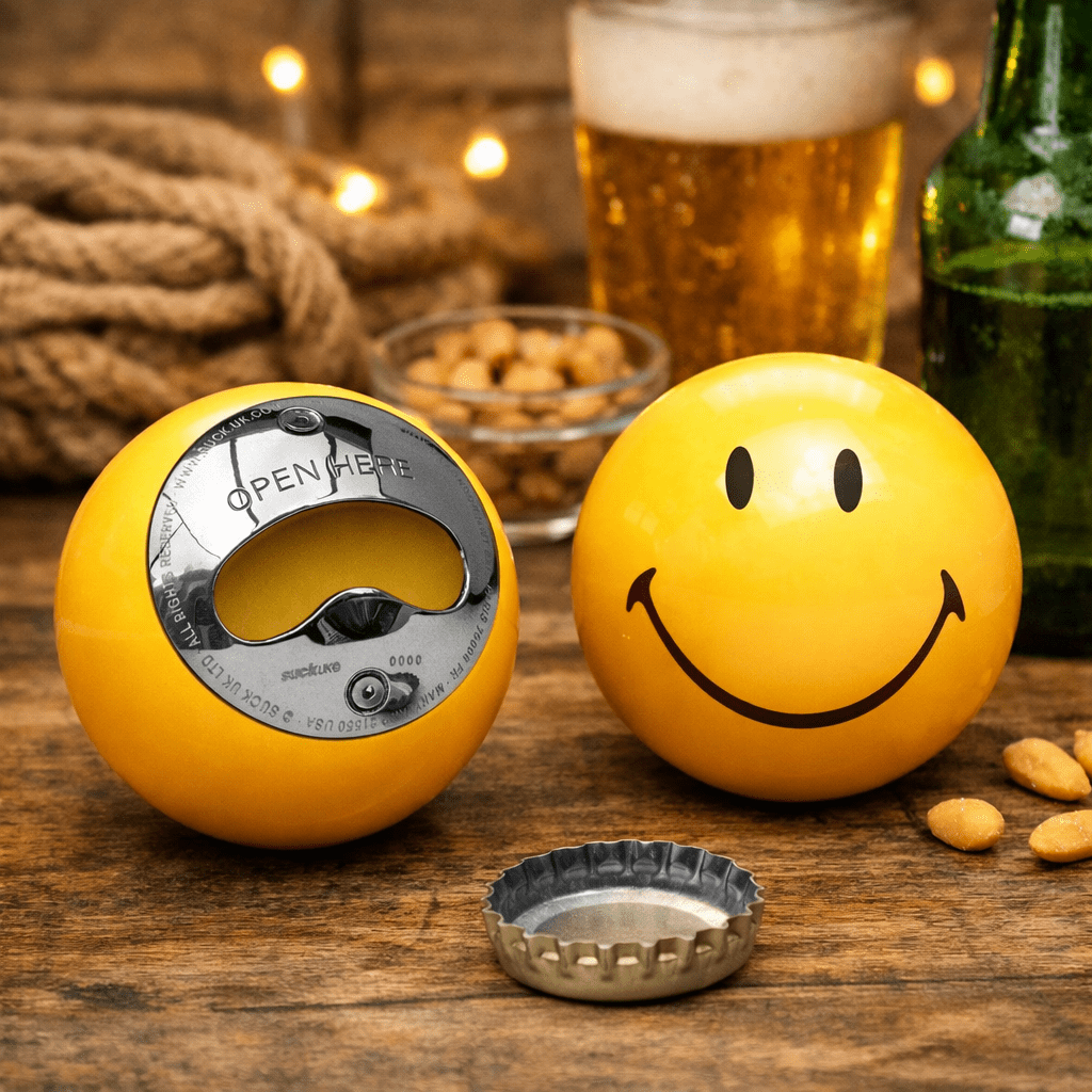 Yellow smiley pool ball bottle opener with metal opening ring and grin
