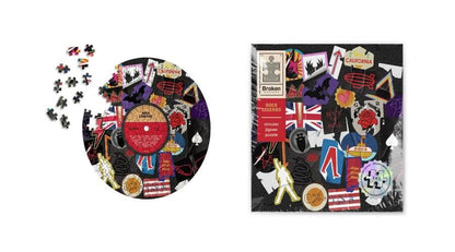 Circular rock jigsaw puzzle and matching puzzle box shown together