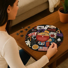 Rock-themed circular jigsaw puzzle with hands fitting pieces