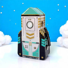 Rocket-shaped lunch box with teal/white rocket graphic and side handle.