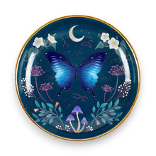 Round trinket dish with blue moth, moon, flowers, and gold rim